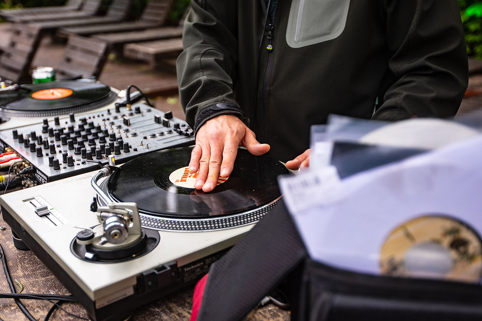 DJ mixing vinyl records on turntables representing mixing vinyl to combat depression
