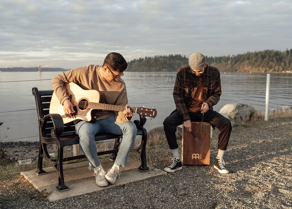 People playing guitar and cajon