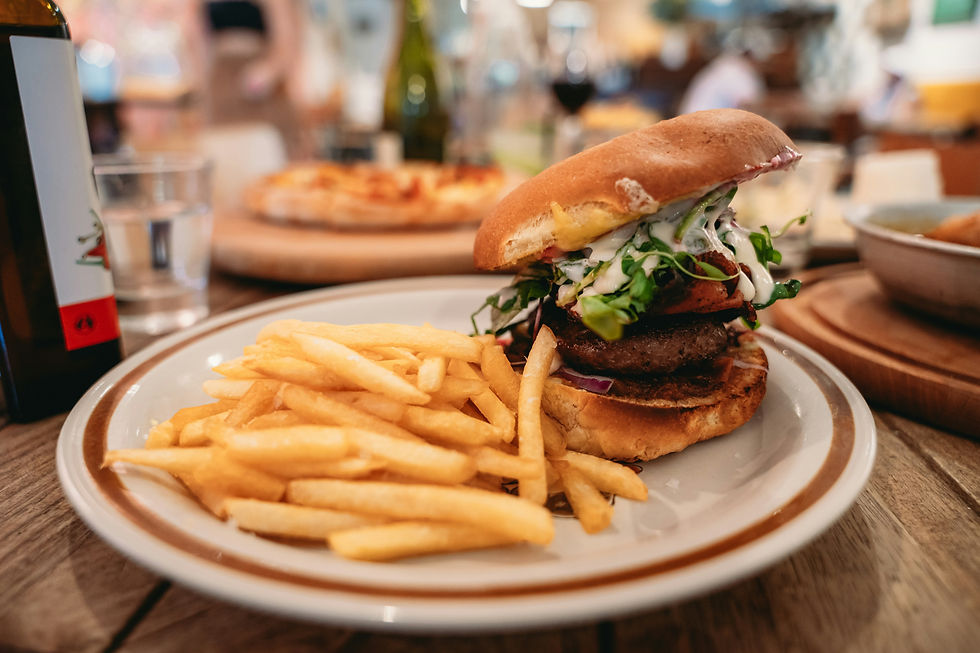 A burger and fries on a plate, portion control