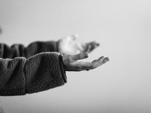 Hands held out in surrender