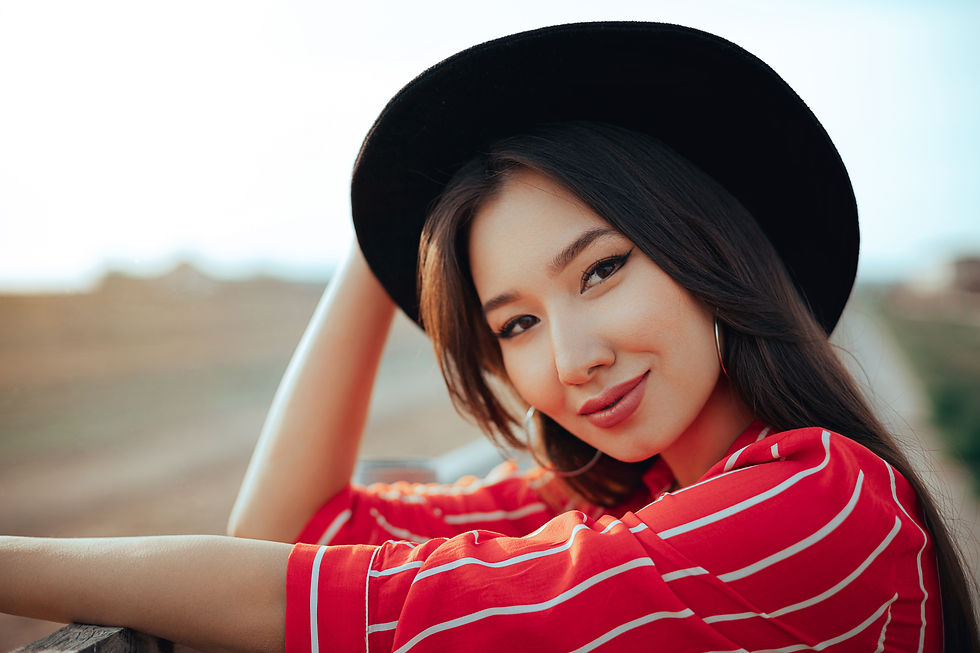 A woman smiling into the camera.