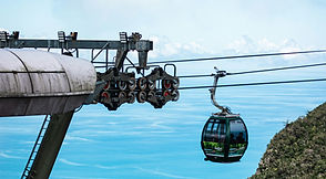 SkyCab cable car gondolas above the green mountains of Langkawi