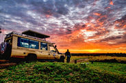Safari vehicle at sunset in Serengeti National Park