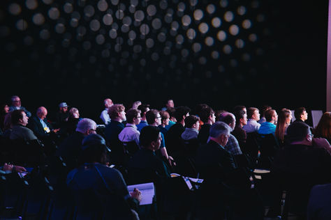 Candid shot of attendees enjoying a conference.
