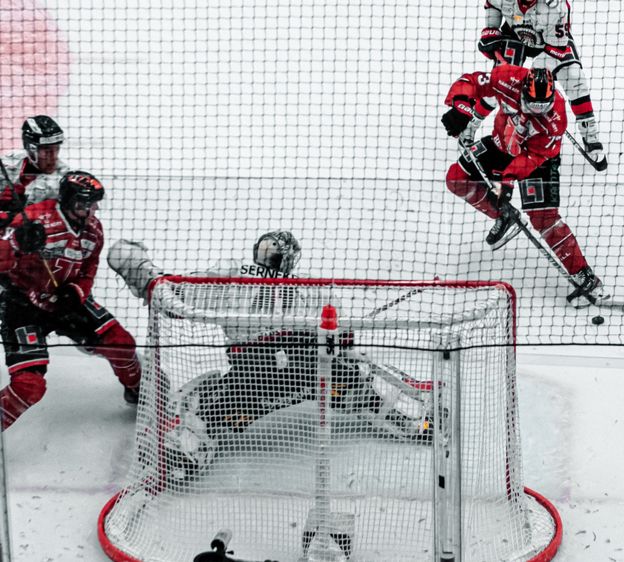 Hockey goalie set in the crease during a game