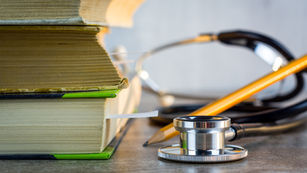 Physician reviewing incorporation documents for medical practice