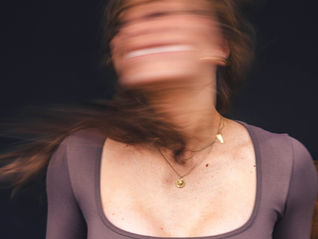 Joyful woman in motion, symbolising the resilience and emotional wellbeing achievable with proper epilepsy management.