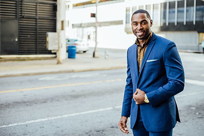 Image of successful black man in suit, no more fear of public speaking