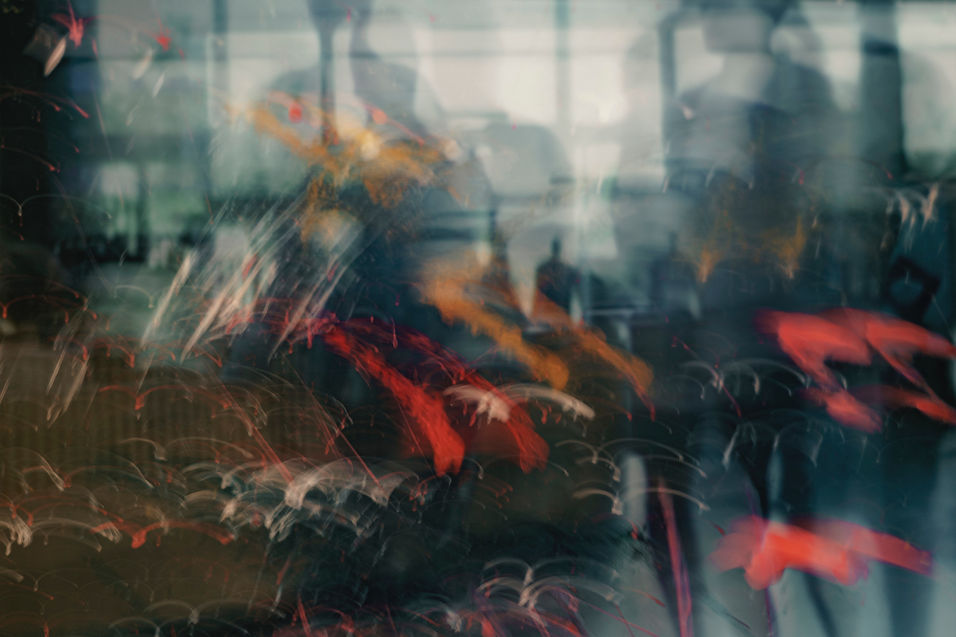 A dream-like vision of a person immersed in lights and overlays, representing altered mental states and hidden influence.