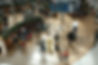 looking down over a busy airport departure lounge