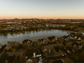 Aerial view of Morristown TN neighborhoods and Cherokee Lake at sunset