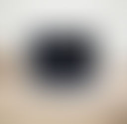 An open laptop resting on a desk, black screen