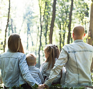 A couple with two kids symbolizing parenting