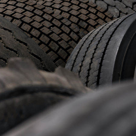 A closeup of a group of old tires
