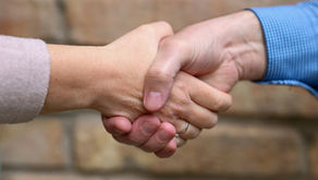 a business owners shaking the hands of a customer