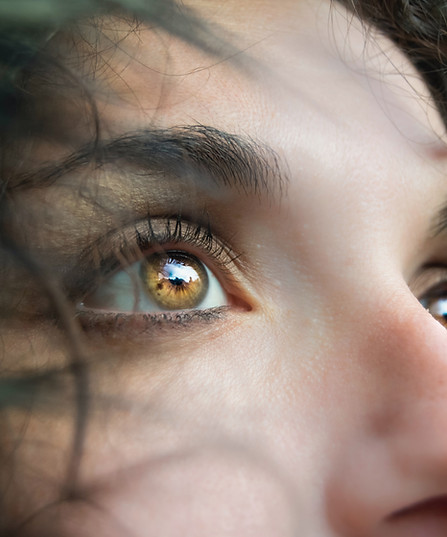 Woman with brown eyes looking up