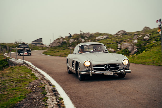 Exclusive classic car tour through Swiss mountains in Engadin and a super rare Mercedes 300SL on the road