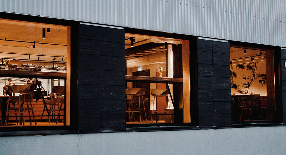 Image of cafe with large glass window by MAD VISUAL