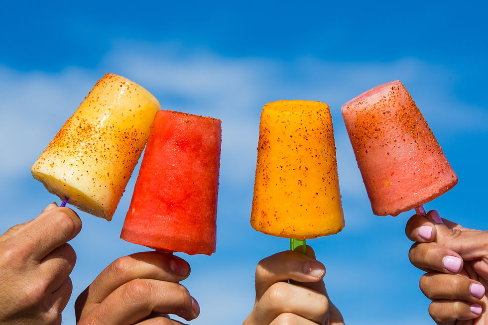 A variety of popsicles on sticks.
