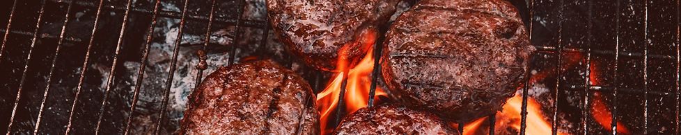 Grilling hamburgers on a BBQ