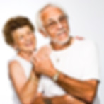Elderly couple holding hands