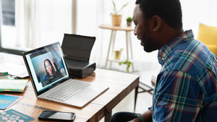 Man in an online interview on laptop screen