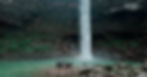 Group enjoying a waterfall stop during a Meghalaya road journey