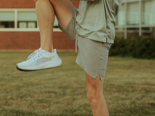 man stretching knee