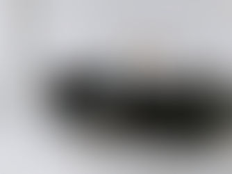 Woman resting on couch appearing mentally exhausted, representing ADHD burnout and mental fatigue.