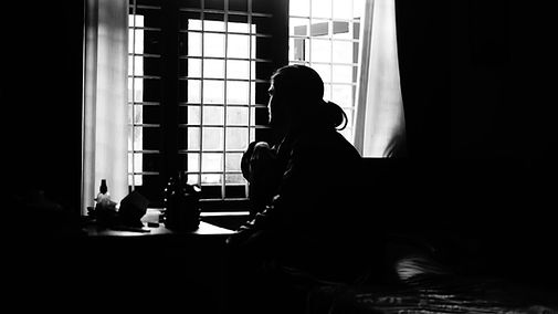 Image of a woman looking out the window.