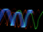 Abstract neon light trails in blue, green, and orange wave across a black background, with repeated OK text forming arcs.