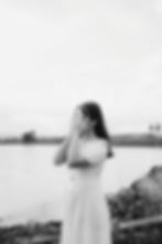 young woman covering her face with her hands