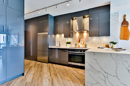 minimalist grey kitchen with wood flooring