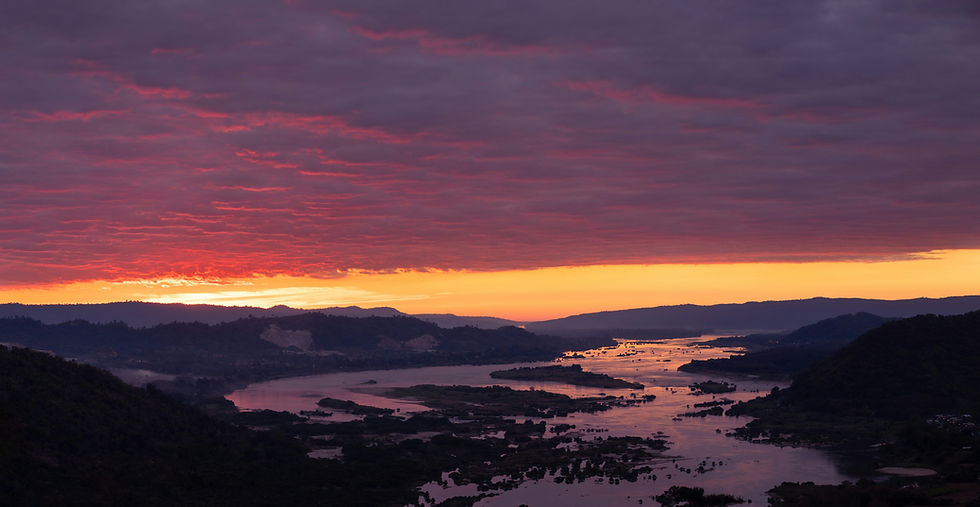 Sunset over the Mekong River | Photo by Kittitep Khotchalee on Unsplash