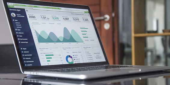 Financial analytics dashboard displayed on a laptop, tracking revenue cycle performance and reducing claim denial rates.