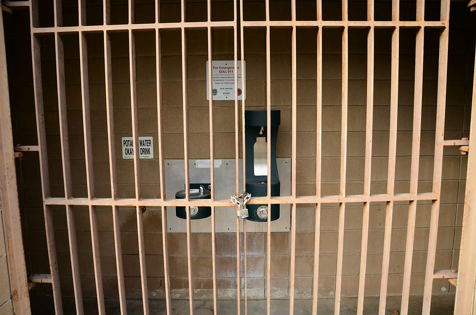 a cell phone in a wooden jail cell