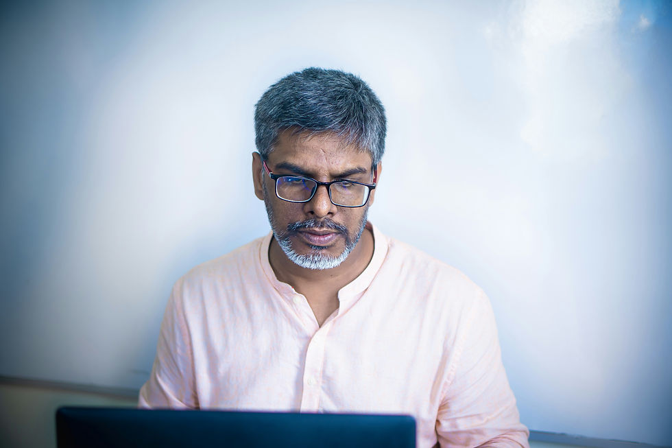 H-1B worker comparing EB-5 and other green card alternatives on a laptop