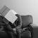 Man sitting on sofa with carboard box on his head. Representing how overthinking and rumination feels like