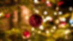 Red Christmas ornaments with Christmas lights.