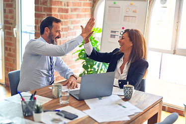 Two people giving a high five