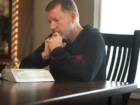 Person at a desk reviewing notes after receiving a federal law enforcement psychological evaluation non-recommendation