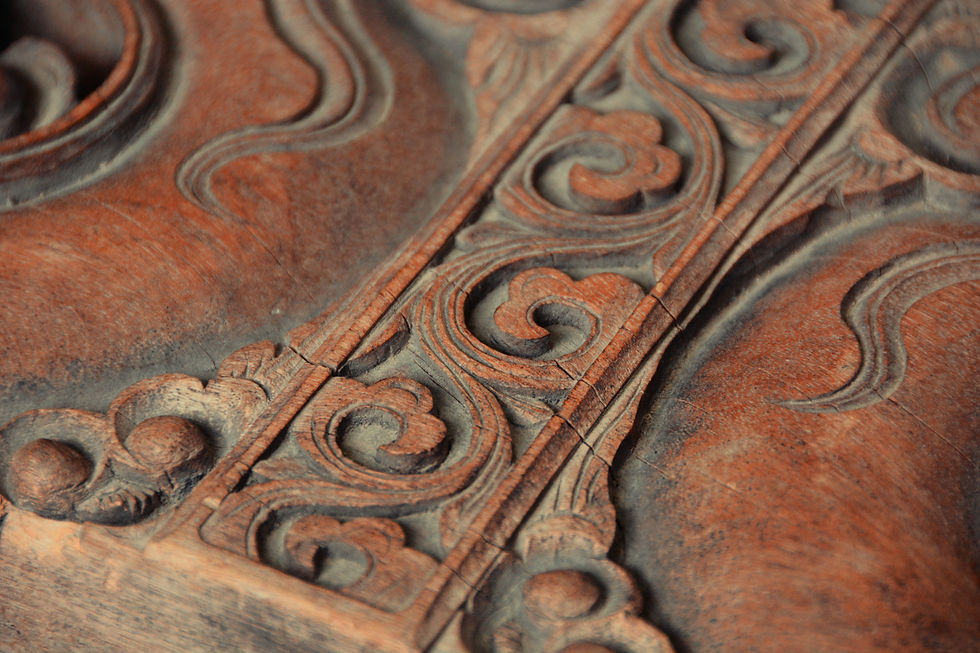 Detailed close-up of historic wood molding and millwork on a preserved Victorian-era building interior showing original craftsmanship and profile detail.