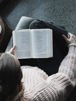 A women reading with her coffee
