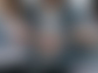 three women linking arms wearing denim jackets