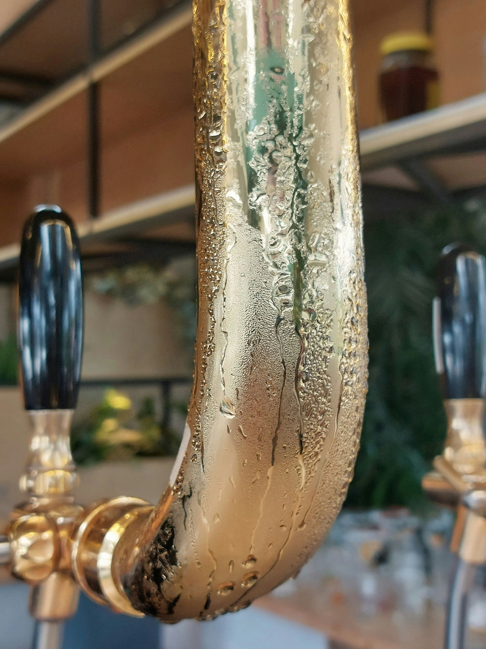 Close-up view of a clean beer tap in a pub