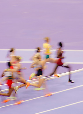 Sprinters running toward finish line