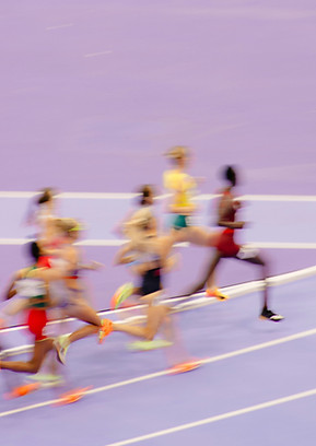 Sprinters running toward finish line