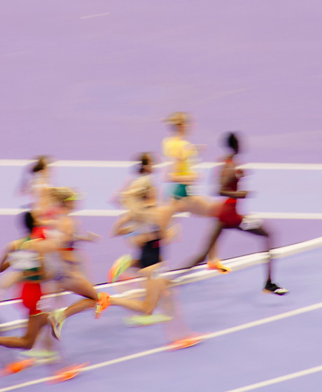 Sprinters running toward the finish line