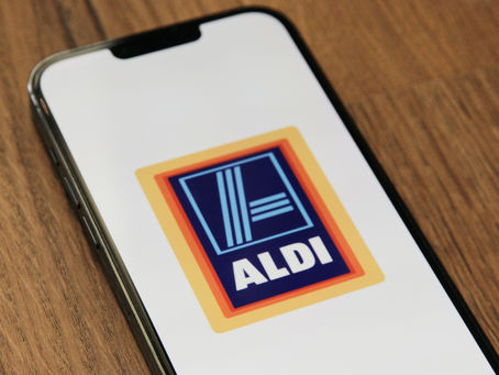 Phone showing ALDI logo