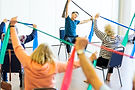 Older women taking part in chair exercises